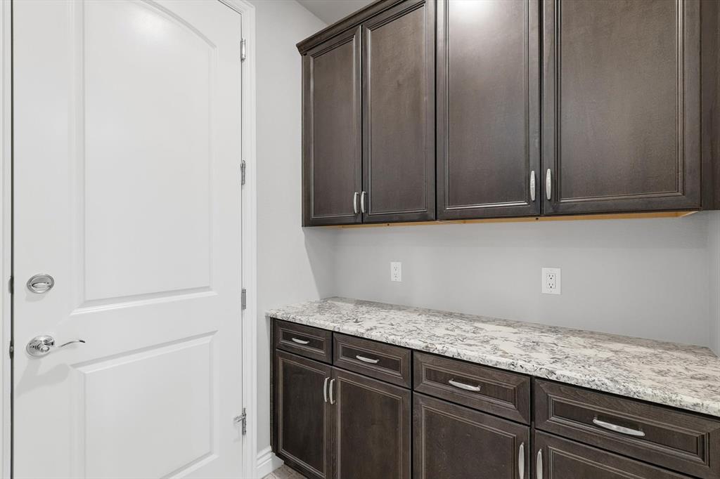 8813 Basanite Avenue Denton, TX 76207 - Photo 14 of 40 a view white cabinets and sink