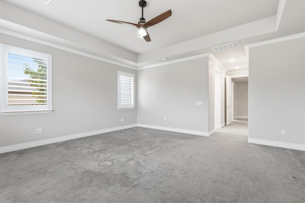 8813 Basanite Avenue Denton, TX 76207 - Photo 17 of 40 a view of an empty room with a window