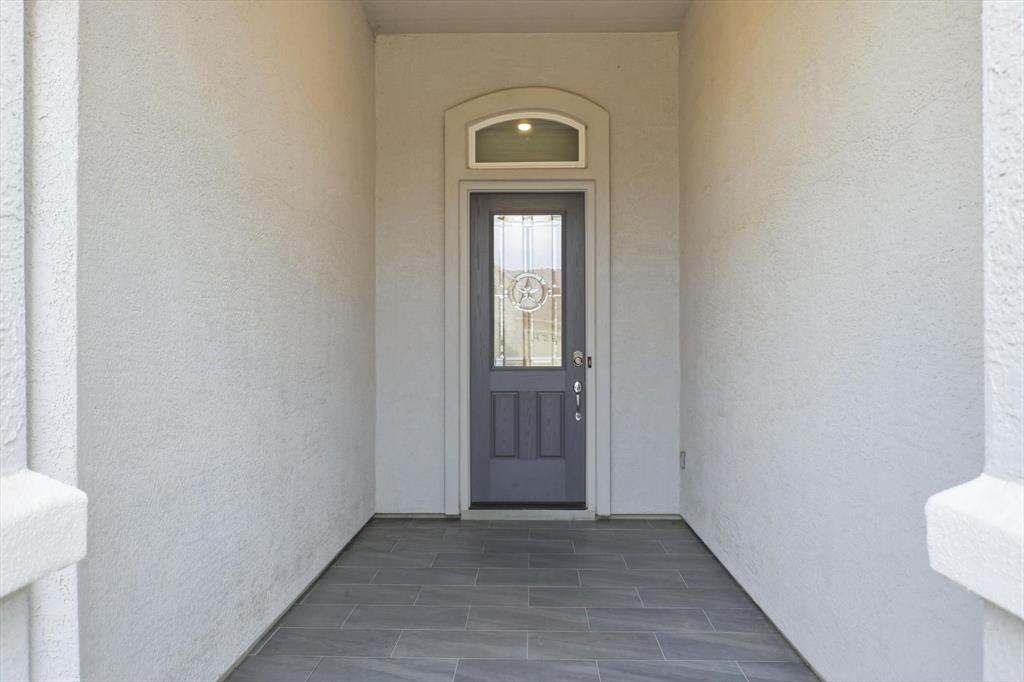 8813 Basanite Avenue Denton, TX 76207 - Photo 39 of 40 a view of a livingroom with wooden floor and a window
