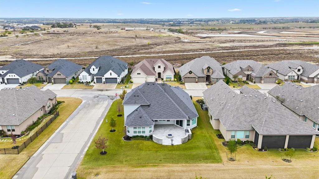 8813 Basanite Avenue Denton, TX 76207 - Photo 36 of 40 a view of a swimming pool with a lawn chairs