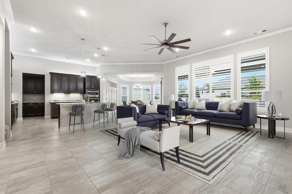 8813 Basanite Avenue Denton, TX 76207 - Photo 4 of 40 a living room with furniture and a large window