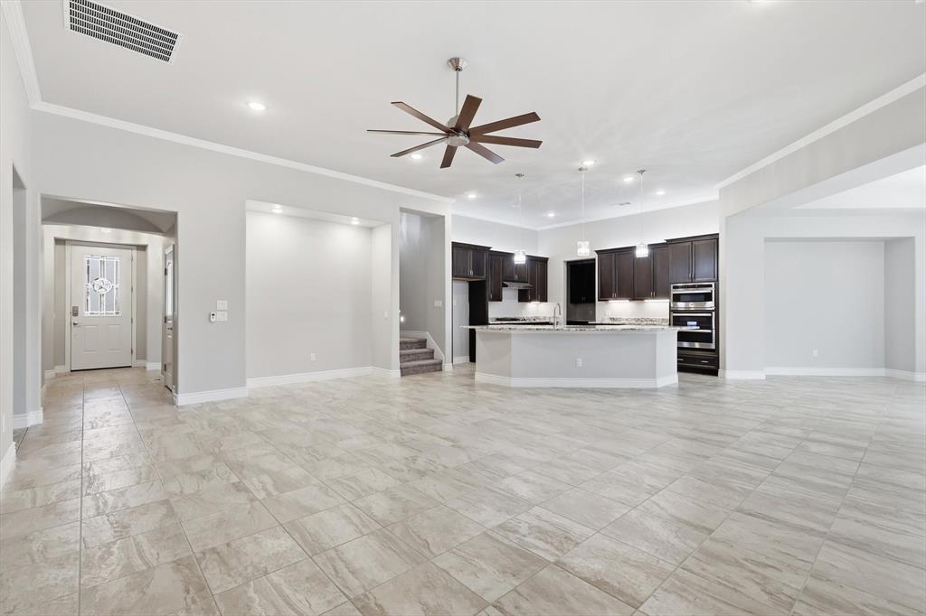 8813 Basanite Avenue Denton, TX 76207 - Photo 5 of 40 a view of a kitchen with a sink and a window