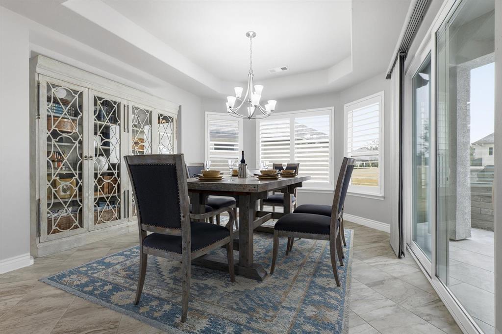 8813 Basanite Avenue Denton, TX 76207 - Photo 6 of 40 a view of a dining room with furniture and window