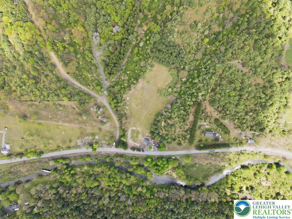 4880 Little Gap Road Kunkletown, PA 18058 - Photo 92 of 100 This elevated perspective captures expansive natural surroundings, with a road and flowing river creating a serene landscape.