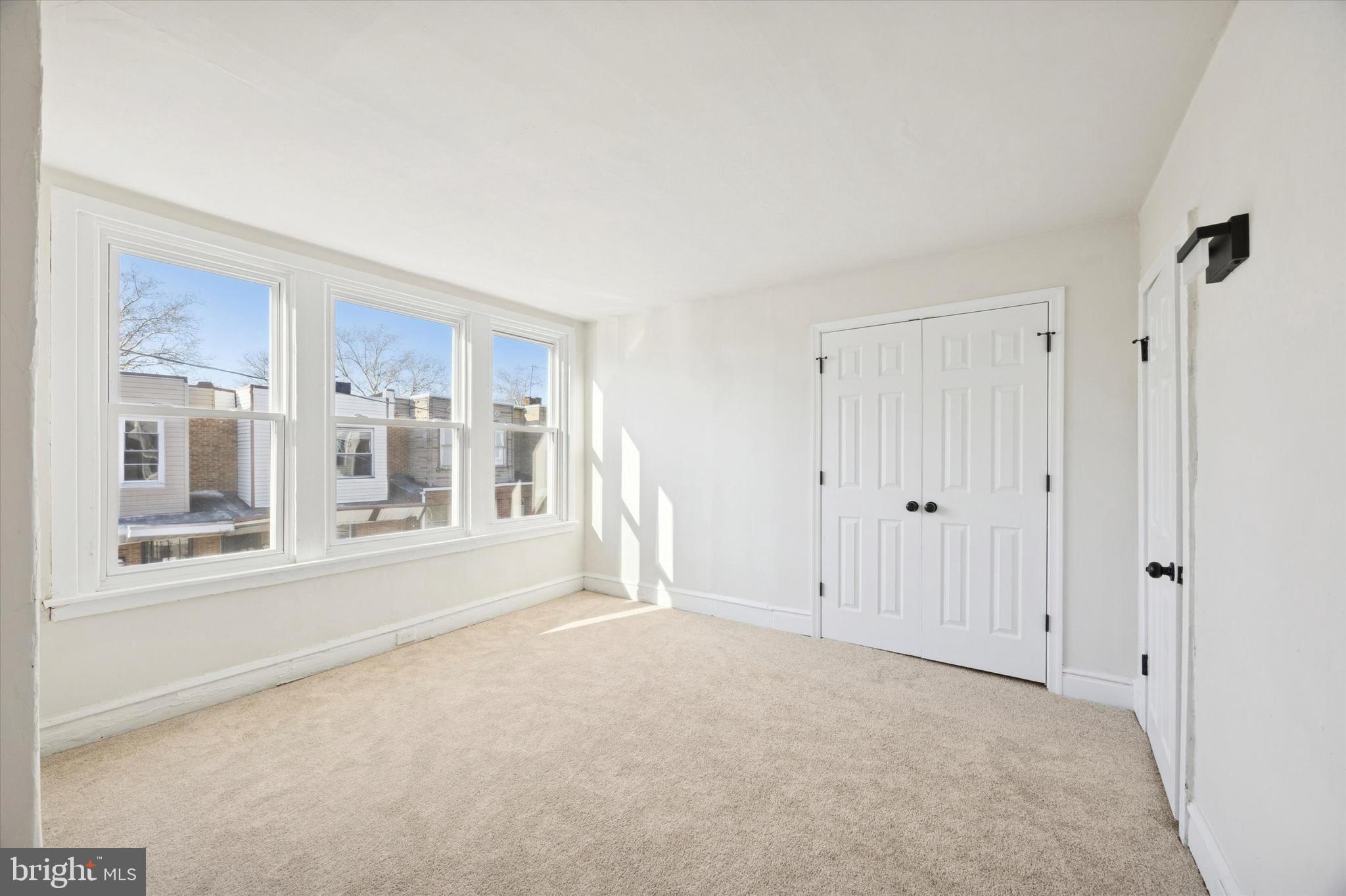 2537 South Millick Street Philadelphia, PA 19142 - Photo 14 of 15 a view of an empty room with a window
