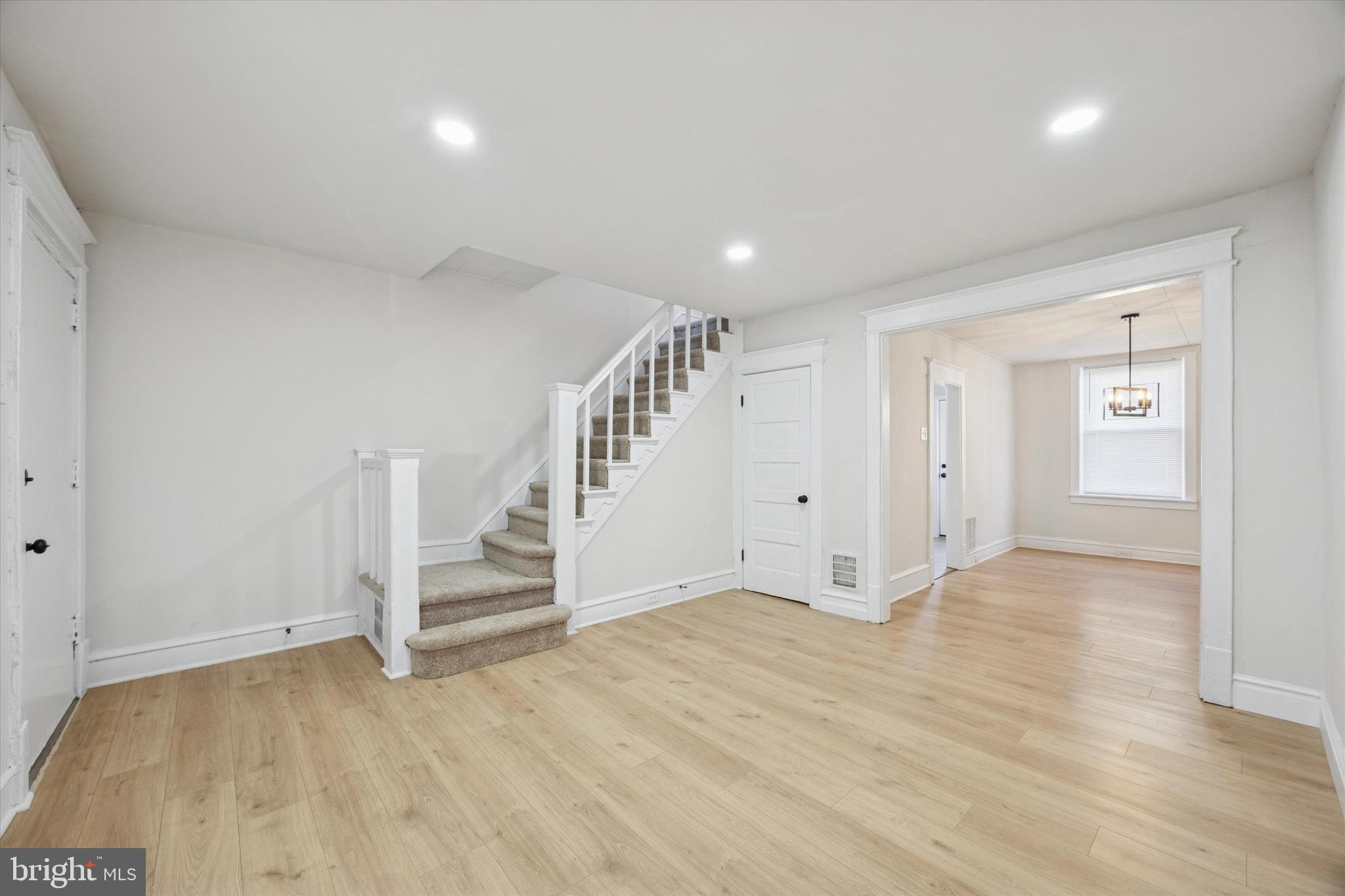 2537 South Millick Street Philadelphia, PA 19142 - Photo 4 of 15 an empty room with wooden floor and white walls