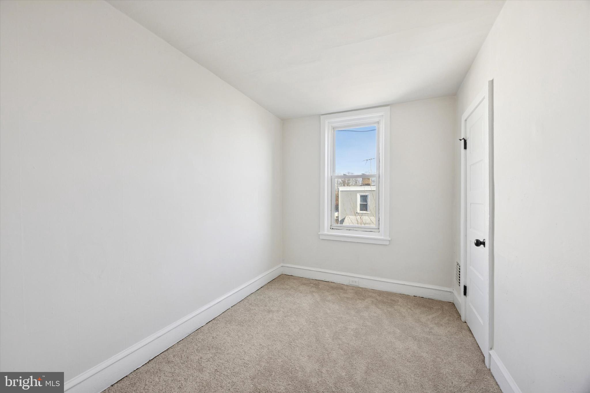 2537 South Millick Street Philadelphia, PA 19142 - Photo 9 of 15 a view of an empty room with a window