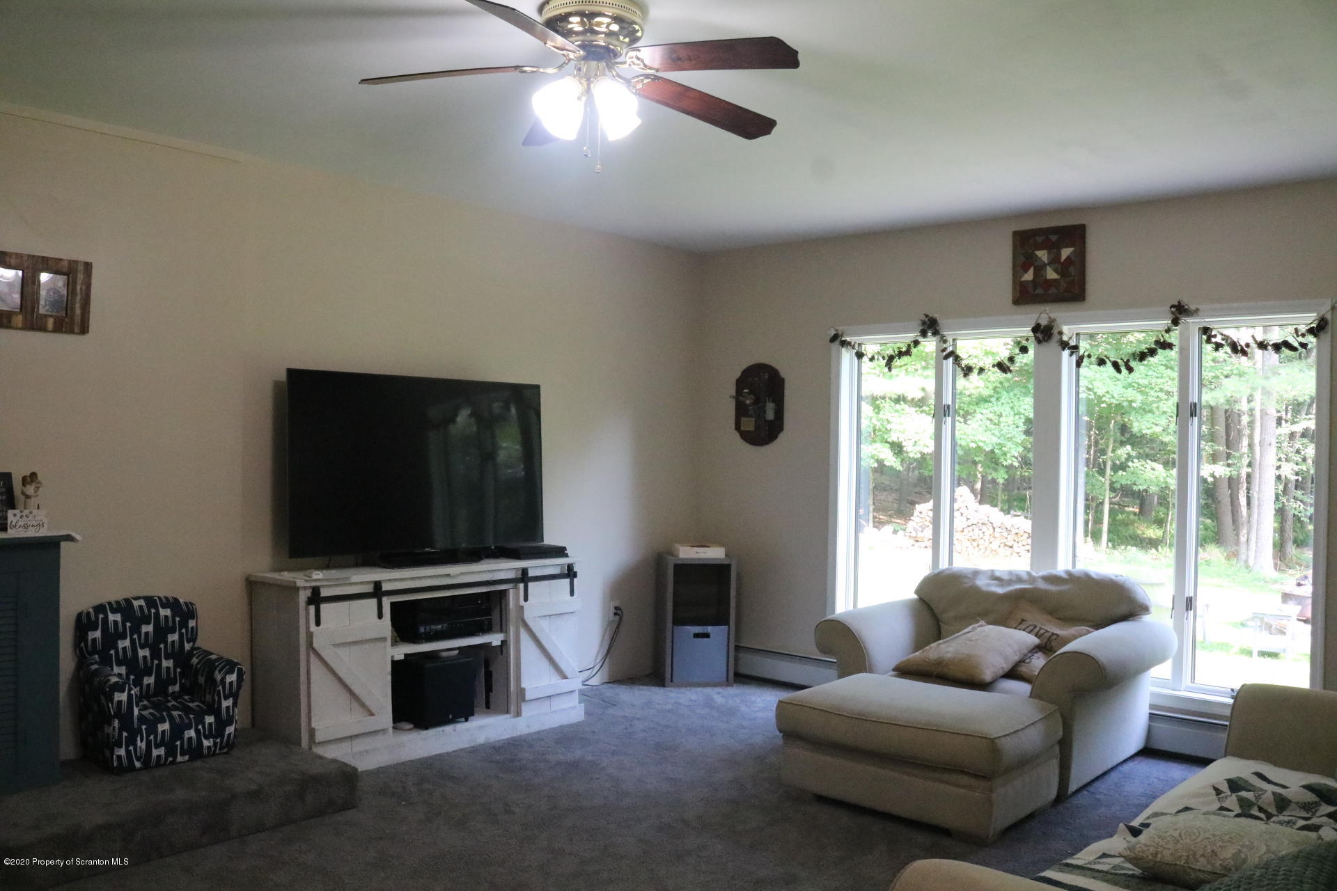 871 Swamp Road Hunlock Creek, PA 18621 - Photo 11 of 64 a living room with furniture and a flat screen tv