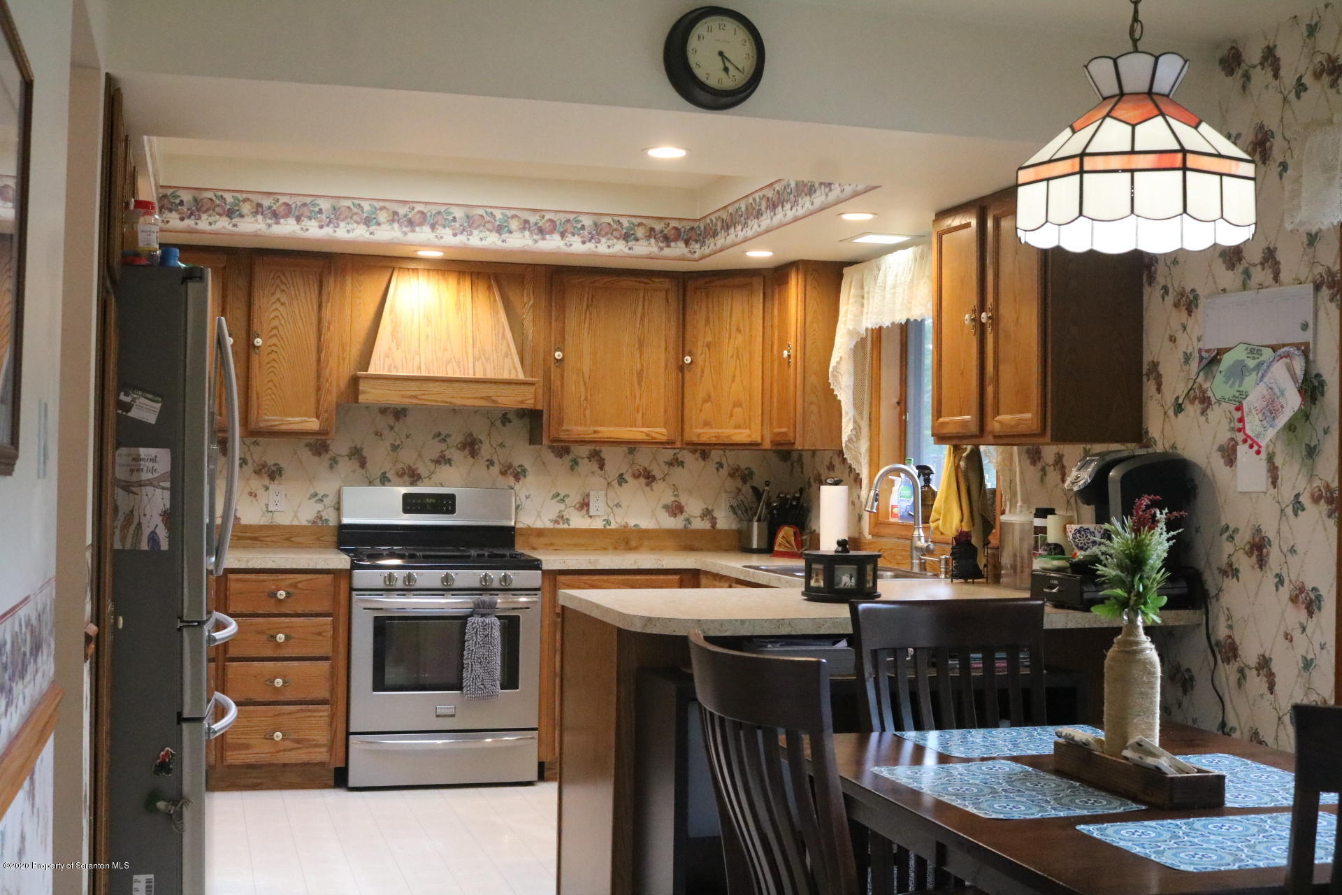 871 Swamp Road Hunlock Creek, PA 18621 - Photo 19 of 64 a kitchen with stainless steel appliances granite countertop a stove a sink and a microwave