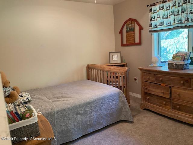 871 Swamp Road Hunlock Creek, PA 18621 - Photo 26 of 64 a bedroom with a bed and a dresser