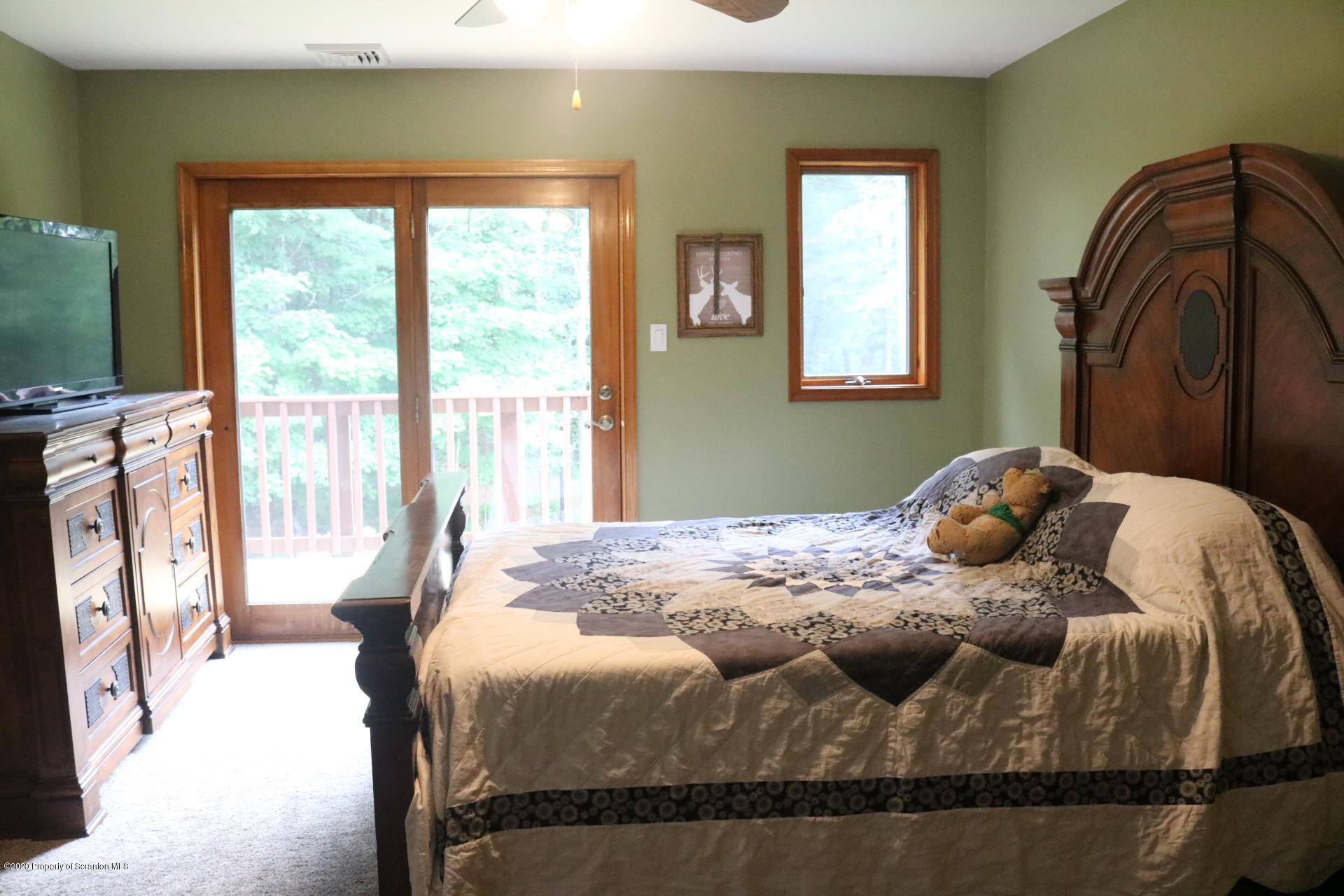 871 Swamp Road Hunlock Creek, PA 18621 - Photo 39 of 64 a bedroom with a bed next to a window