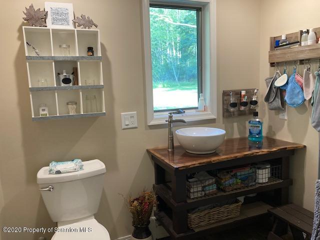 871 Swamp Road Hunlock Creek, PA 18621 - Photo 47 of 64 a bathroom with a sink and a toilet