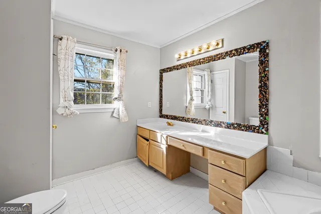 a room with a stove and a mirror