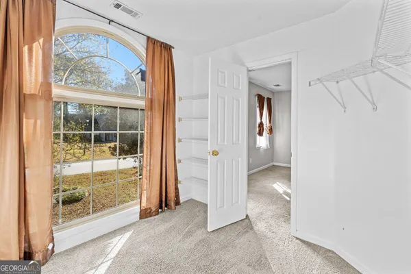 a view of an empty room with a window