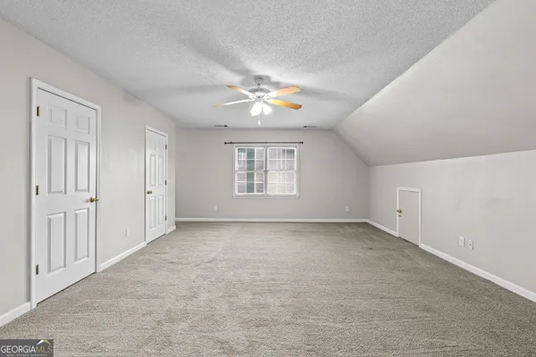 a view of kitchen and hall with wooden floor