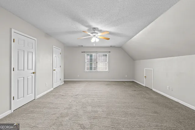 a view of kitchen and hall with wooden floor