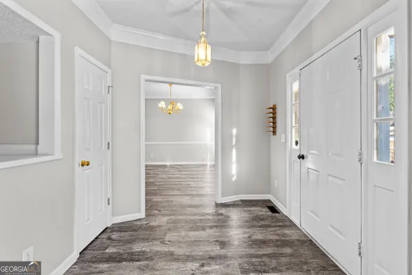 a view of balcony with wooden floor and fence