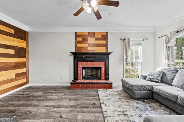 a living room with furniture and a fireplace