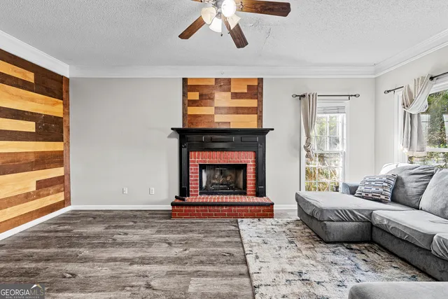 a living room with furniture and a fireplace