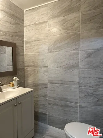 a bathroom with a toilet and sink