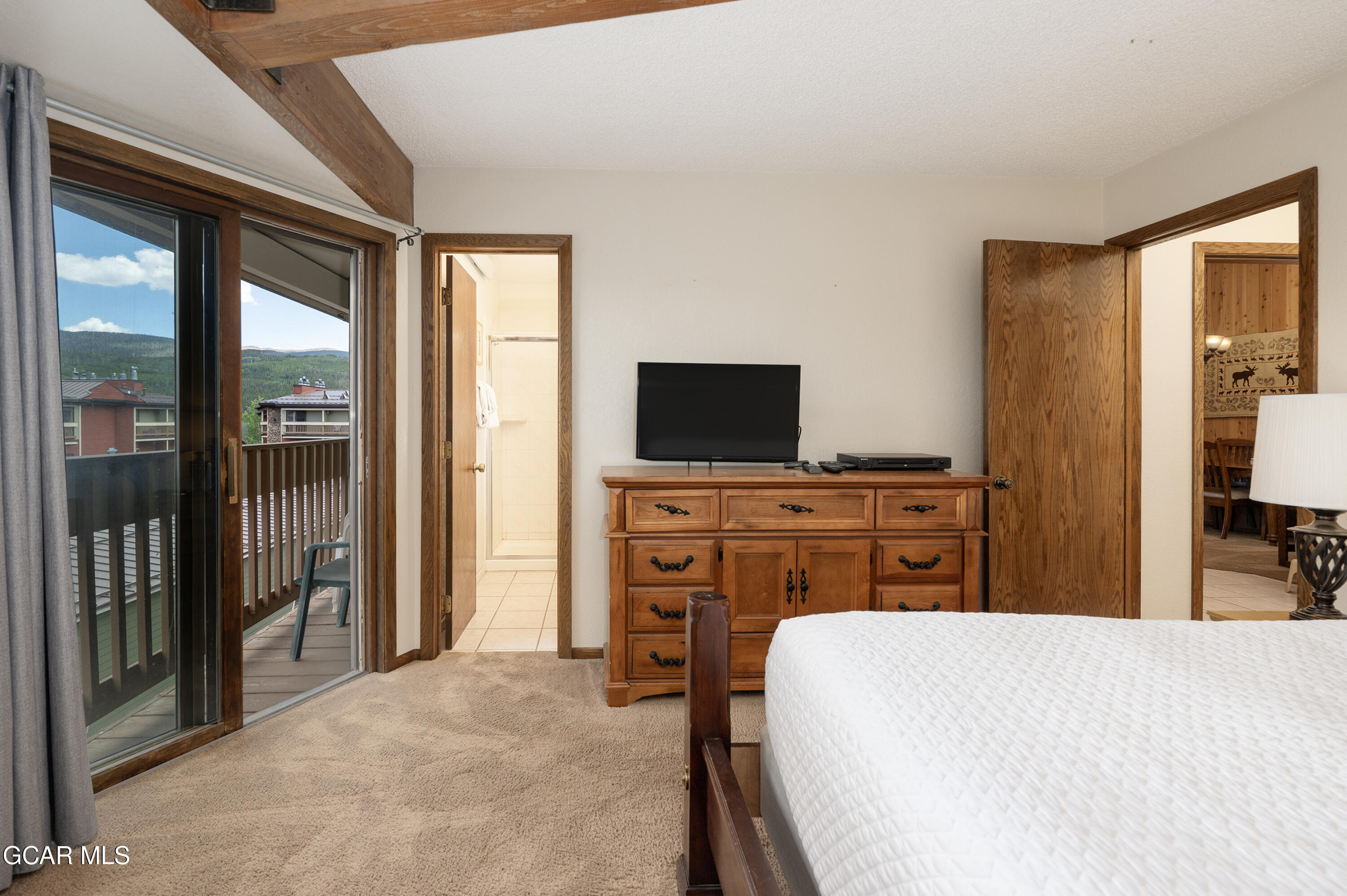 490 Kings Crossing Road, Unit 331 Winter Park, CO 80482 - Photo 12 of 38 a bedroom with a bed and a flat screen tv