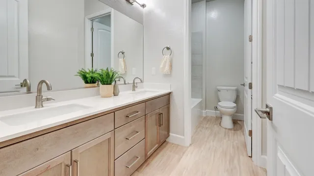 a spacious bathroom with a sink and a mirror