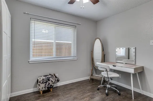 a workspace with furniture and a window
