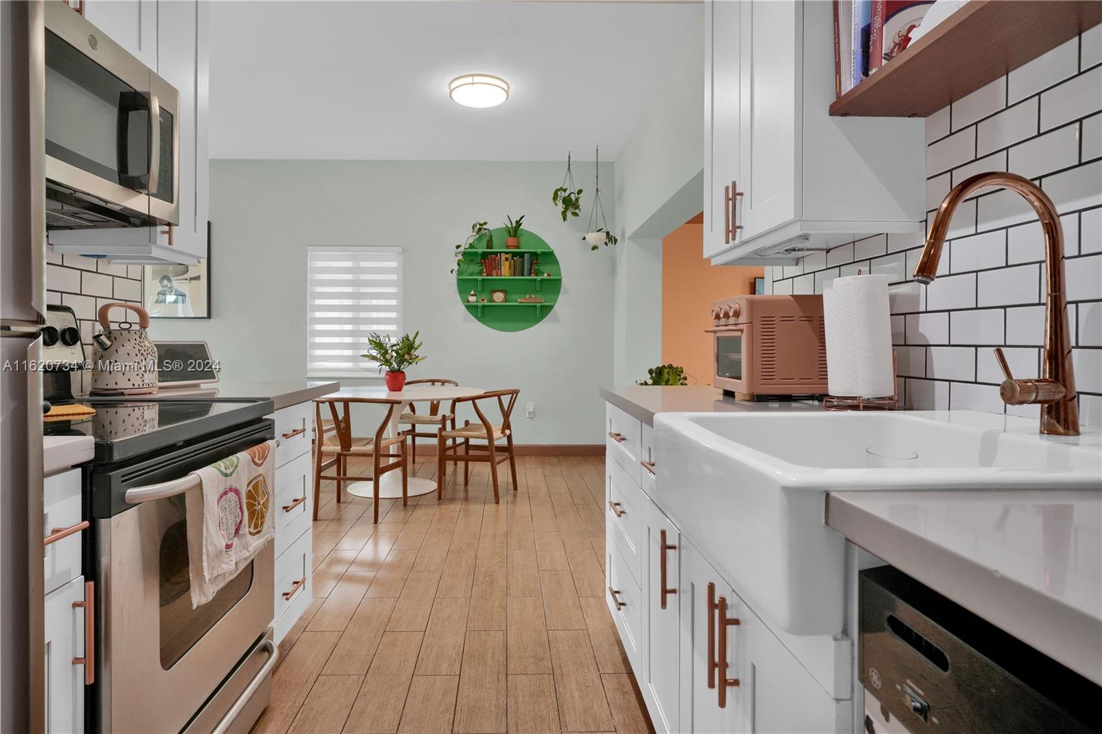 a kitchen with stainless steel appliances granite countertop a stove and a sink