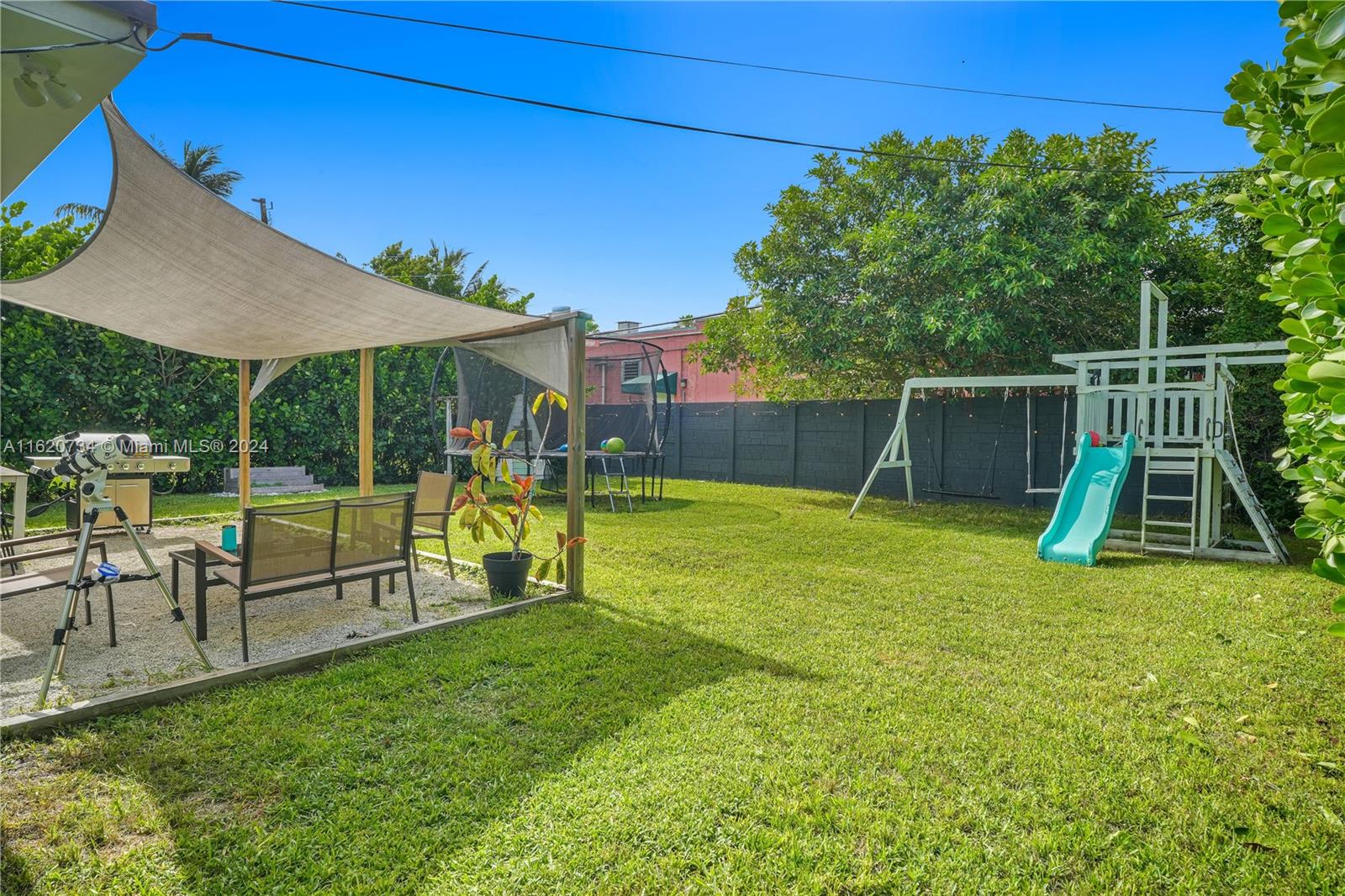 6411 Southwest 41st Street Miami, FL 33155 - Photo 14 of 17 a view of a garden with a slide
