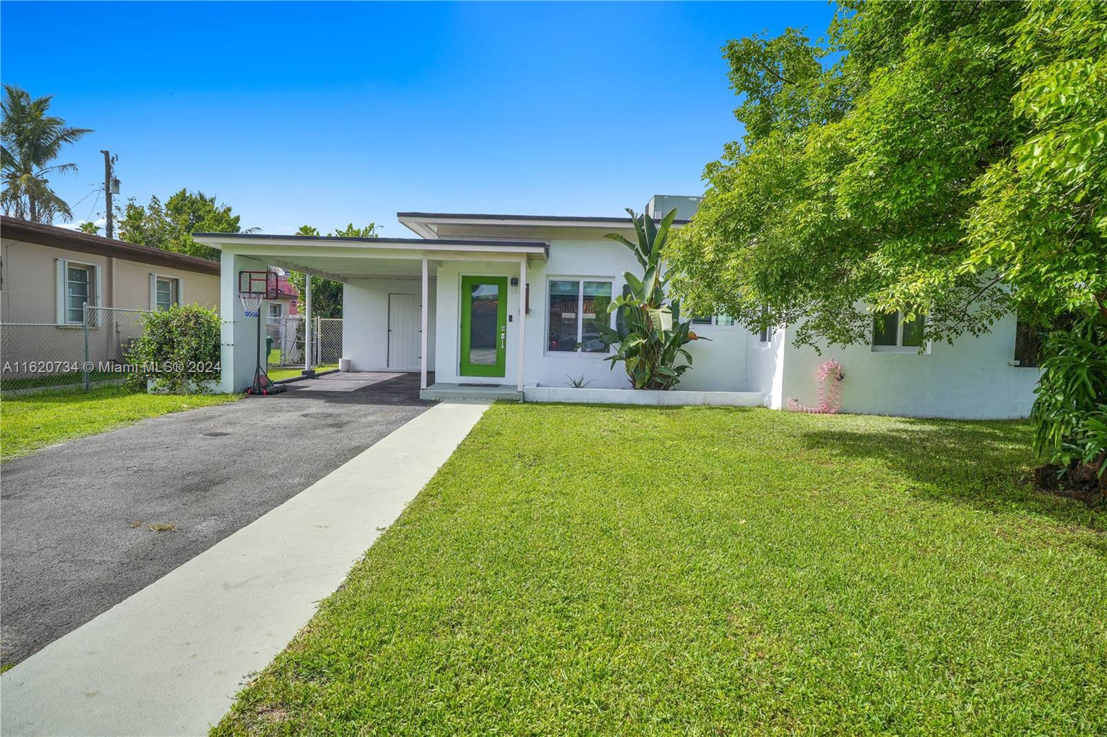 6411 Southwest 41st Street Miami, FL 33155 - Photo 17 of 17 a front view of house with yard and green space