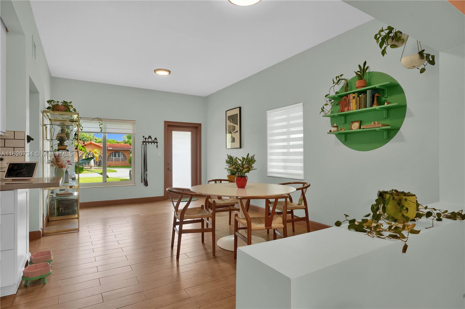 6411 Southwest 41st Street Miami, FL 33155 - Photo 4 of 17 a view of livingroom and dining room with furniture wooden floor and windows