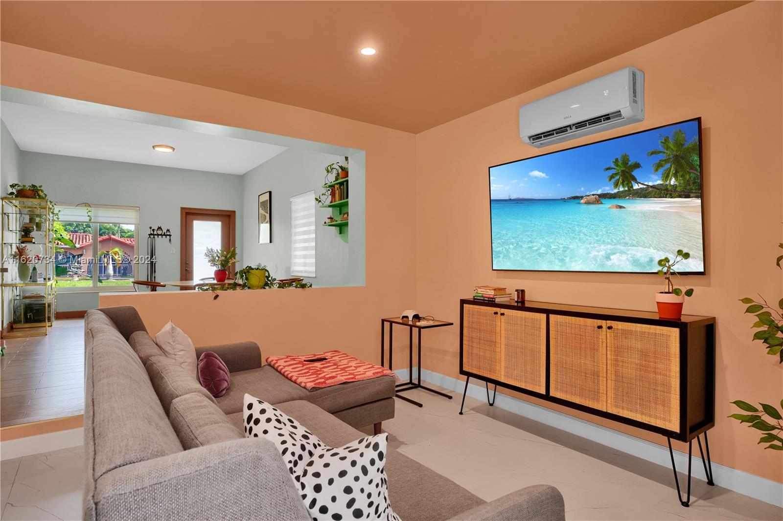 6411 Southwest 41st Street Miami, FL 33155 - Photo 7 of 17 a living room with furniture and a flat screen tv