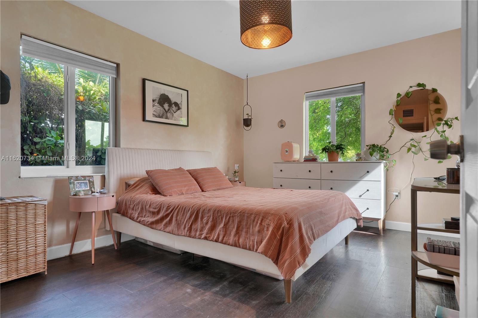 6411 Southwest 41st Street Miami, FL 33155 - Photo 10 of 17 a bedroom with a bed a window and potted plant