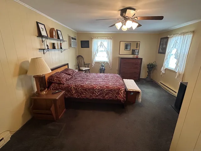 a bedroom with a bed and window
