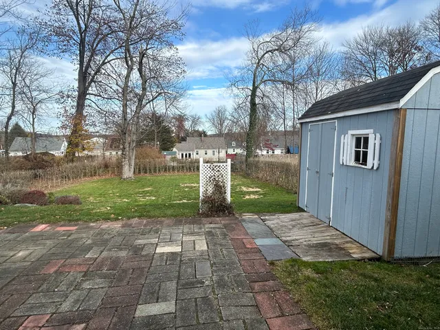 a view of a back yard of the house