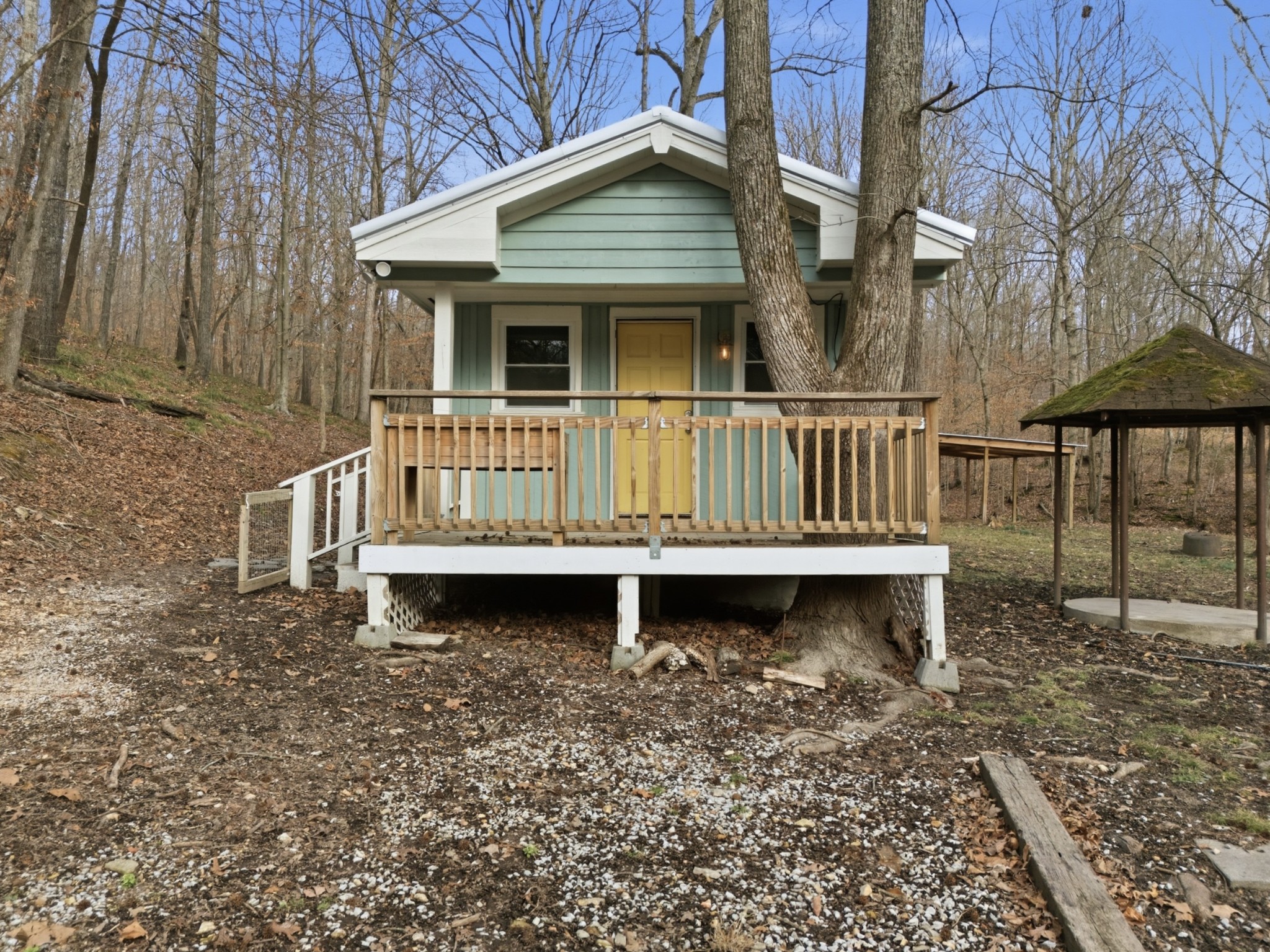a wooden bench sitting in front of a building