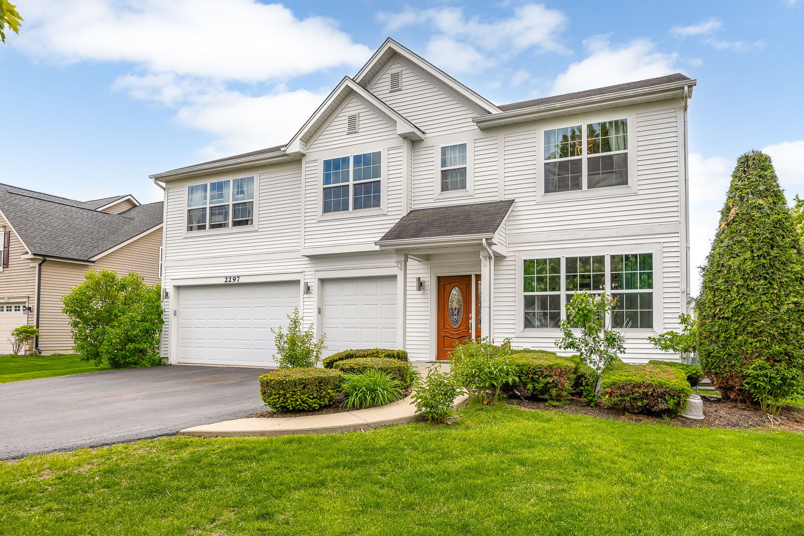 2297 Deerpath Road Bolingbrook, IL 60490 - Photo 3 of 46 a view of a house with a yard and plants