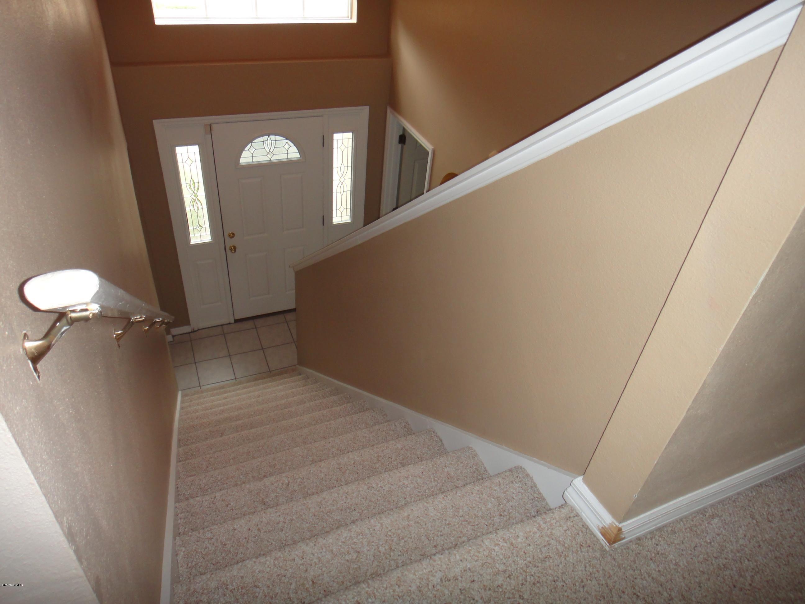 1201 Winding Meadows Road Rockledge, FL 32955 - Photo 22 of 45 Interior Staircase View from 2nd Floor