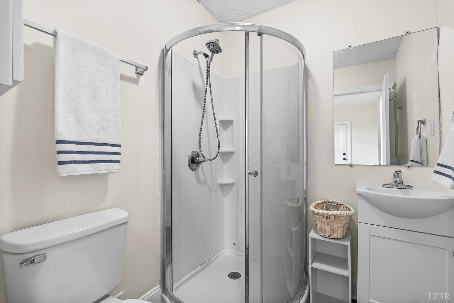 105 Chambers Street Lynchburg, VA 24501 - Photo 12 of 26 a bathroom with a sink a toilet and shower