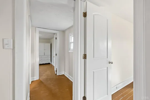 a view of a bathroom from a hallway