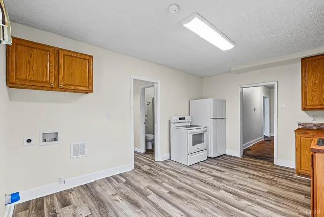 a view of a livingroom with wooden floor
