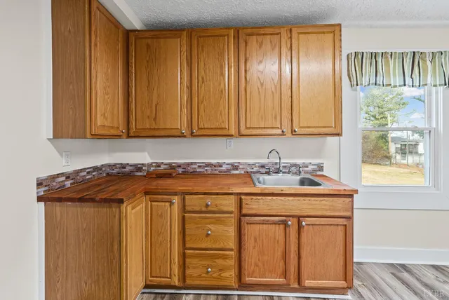 a view of a sink and a window