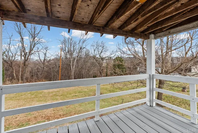 a view of outdoor space with wooden floor