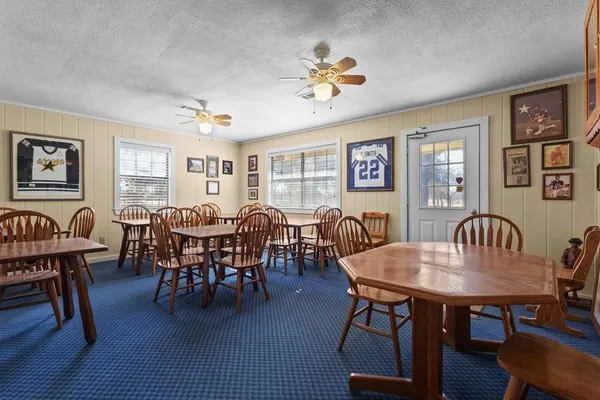 a group of chairs sitting in a kitchen and dining room