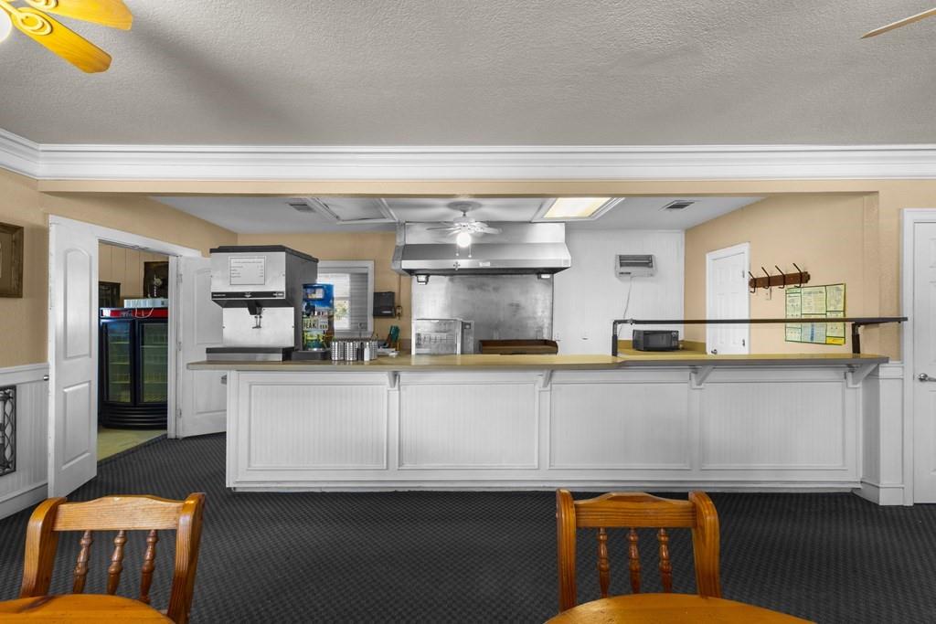 0 Co Road Kemp, TX 75143 - Photo 37 of 40 a living room with stainless steel appliances kitchen island granite countertop furniture and a kitchen view