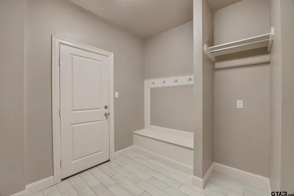 a view of wooden floor and windows in a room