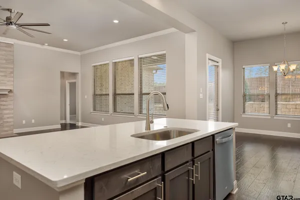 a kitchen with center island a sink and a window