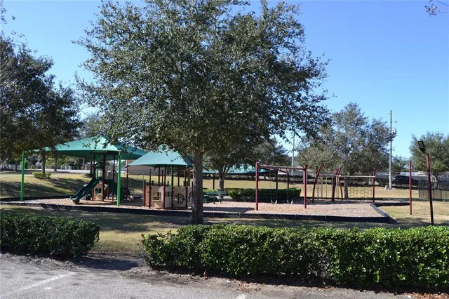 a view of a garden with sitting area