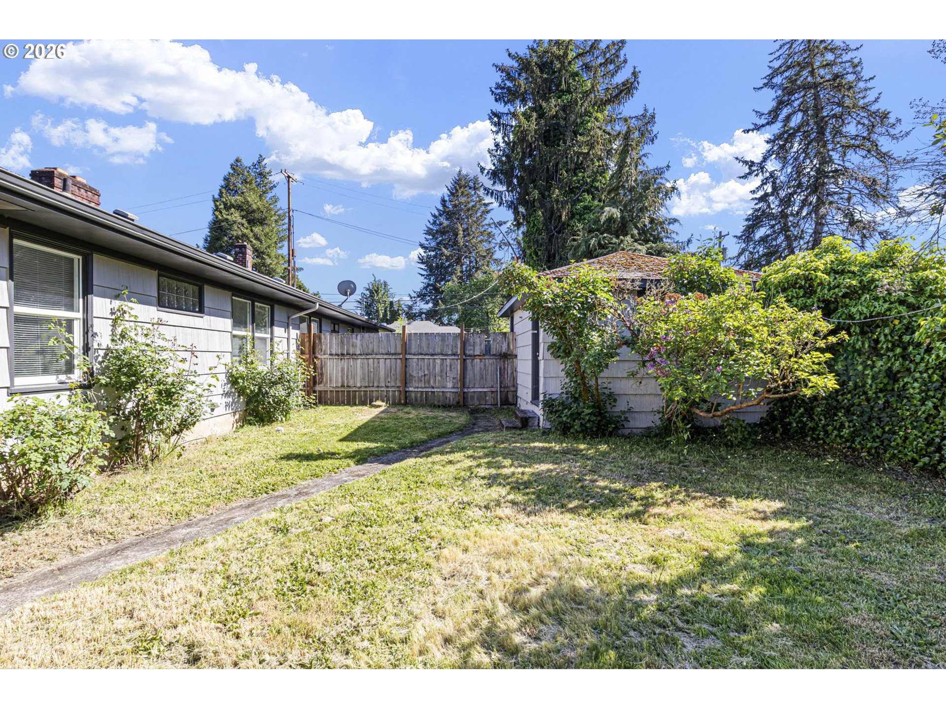 1008 Coburg Road Eugene, OR 97401 - Photo 45 of 46 a backyard of a house with a yard and outdoor seating