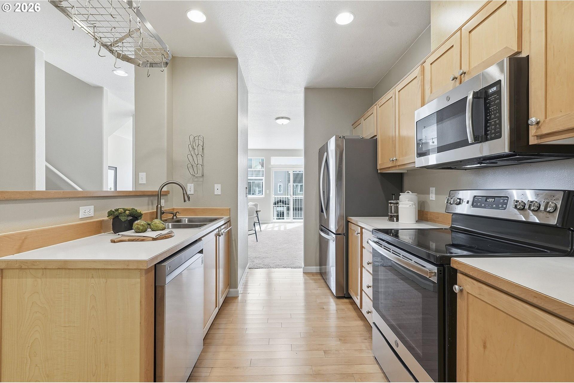 15430 Southwest Sparrow Loop, Unit 105 Beaverton, OR 97007 - Photo 18 of 43 Kitchen/Living Room